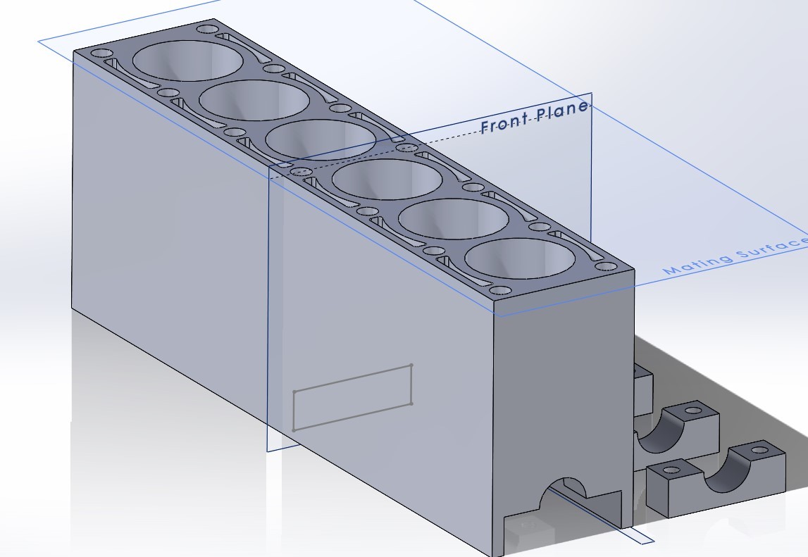 SolidWorks model of an inline-six engine block with cylinder bores, head bolt holes, coolant passages, and main bearing caps
